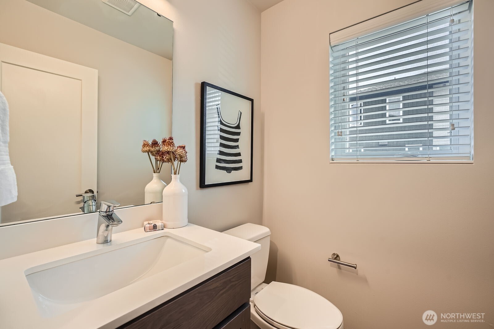 1803 Southwest 96th Lane Seattle, WA 98106 - Photo 13 of 33 a bathroom with a sink vanity mirror and toilet