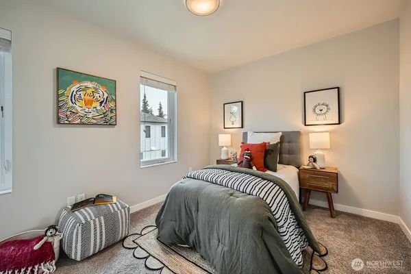a bedroom with bed and a window