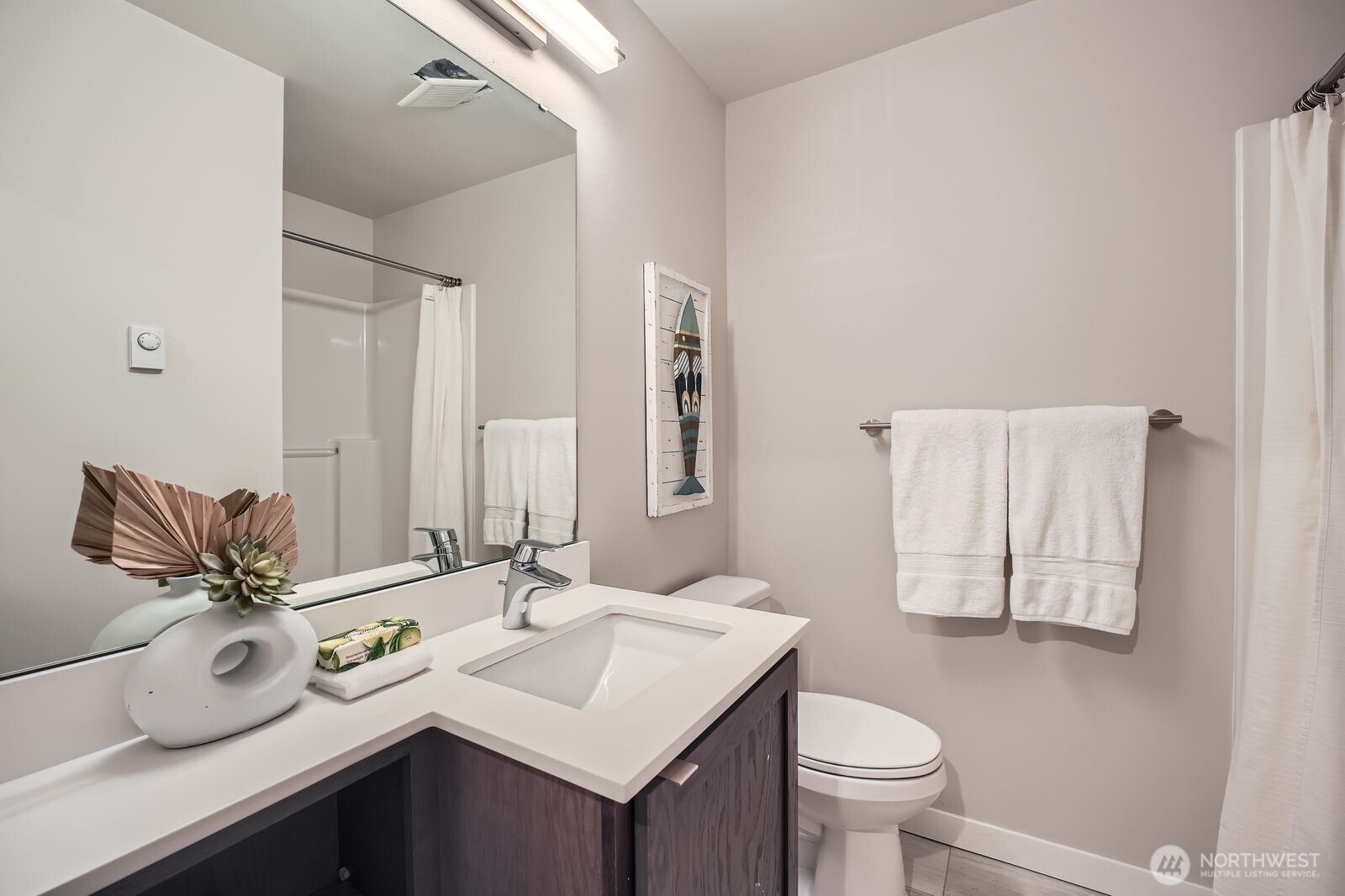 1803 Southwest 96th Lane Seattle, WA 98106 - Photo 29 of 33 a bathroom with a sink toilet and mirror