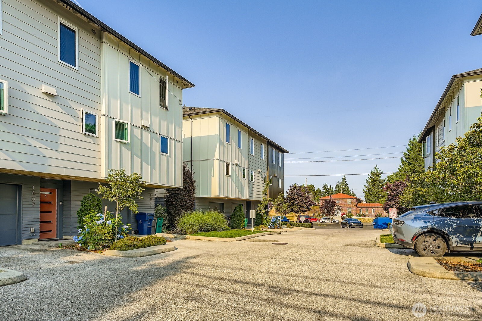 1803 Southwest 96th Lane Seattle, WA 98106 - Photo 33 of 33 a front view of a building with cars parked on road