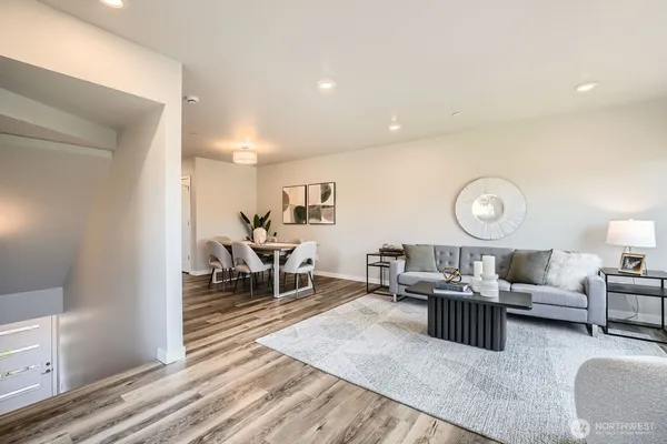 a living room with furniture and a table