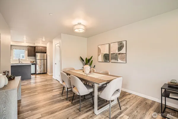 a view of a dining room with furniture and wooden floor