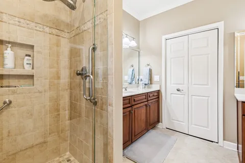 a bathroom with a shower and a sink