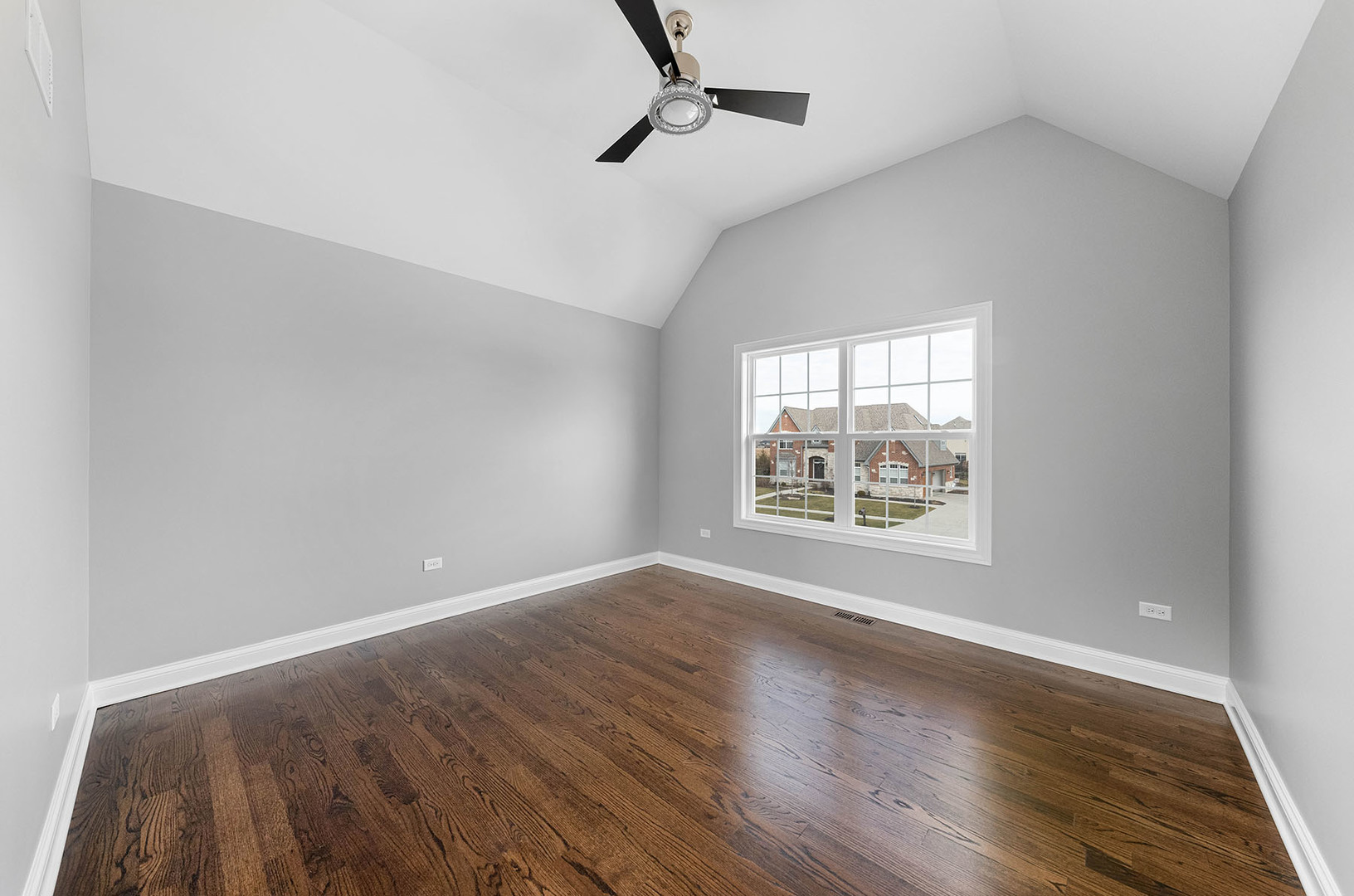 2004 Oldfield Road Darien, IL 60561 - Photo 13 of 40 an empty room with wooden floor and windows