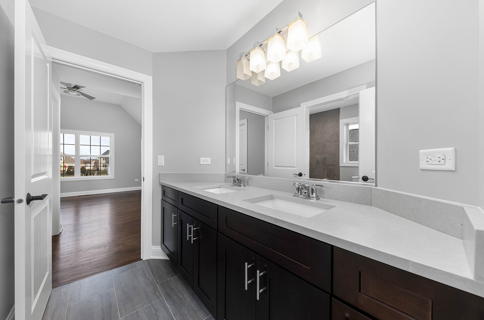 2004 Oldfield Road Darien, IL 60561 - Photo 16 of 40 a bathroom with a sink a light fixture a vanity and a mirror