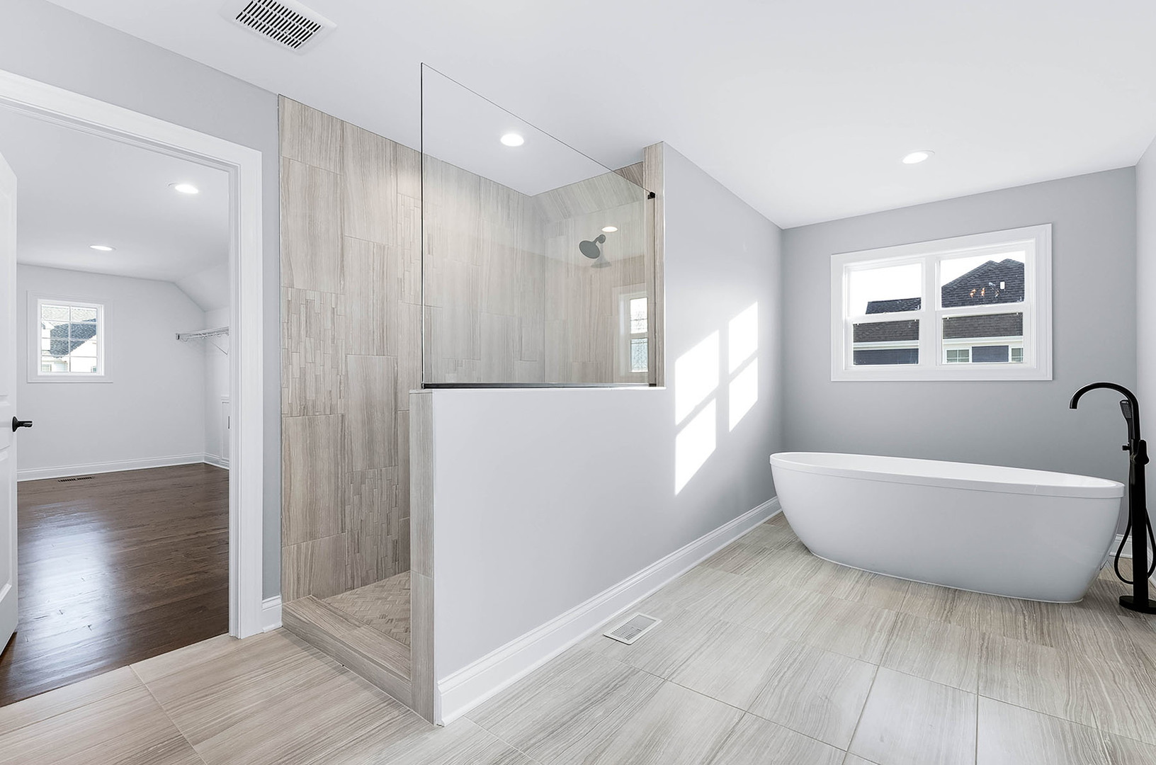 2004 Oldfield Road Darien, IL 60561 - Photo 23 of 40 a bathroom with a bathtub and a shower