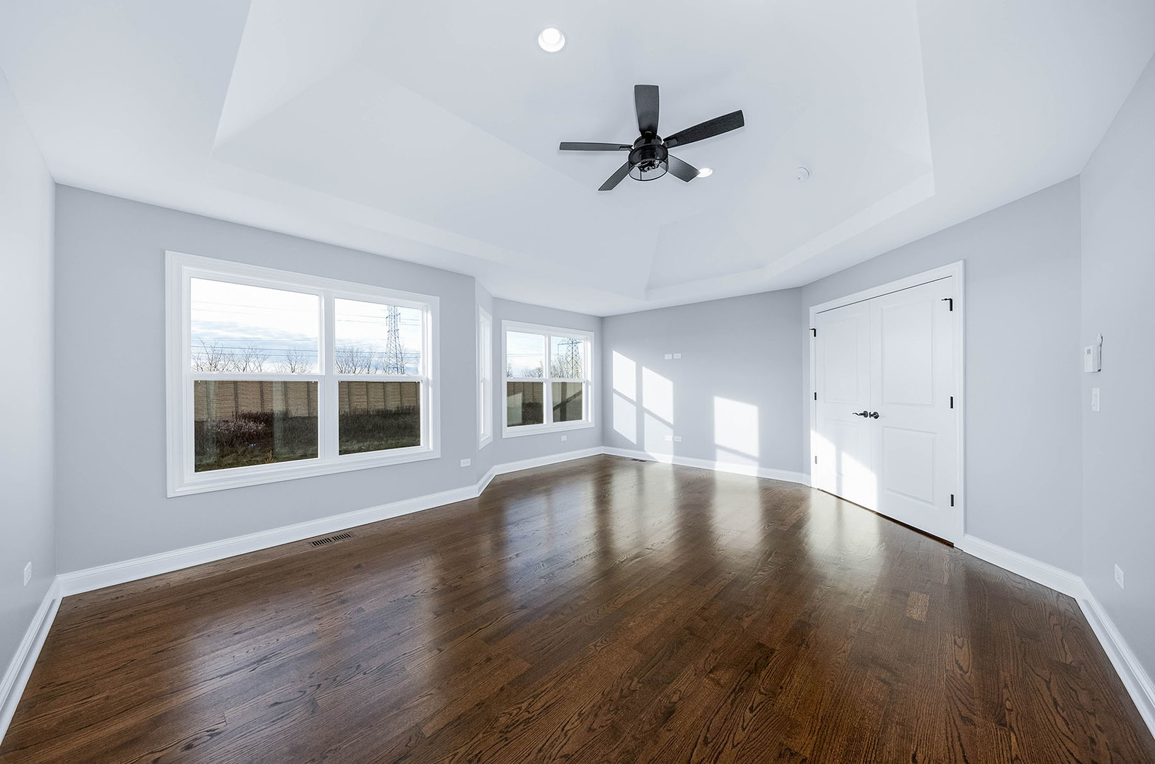 2004 Oldfield Road Darien, IL 60561 - Photo 25 of 40 a view of an empty room with a window and wooden floor
