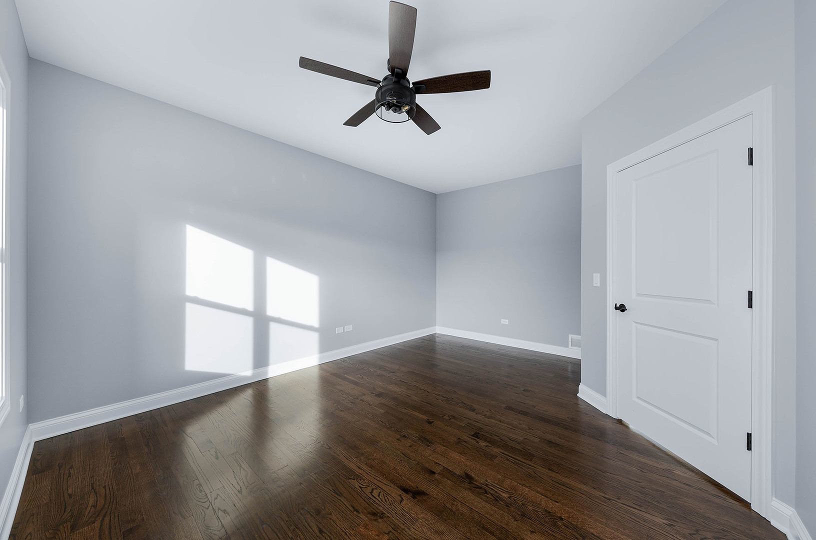 2004 Oldfield Road Darien, IL 60561 - Photo 36 of 40 an empty room with wooden floor fan and windows