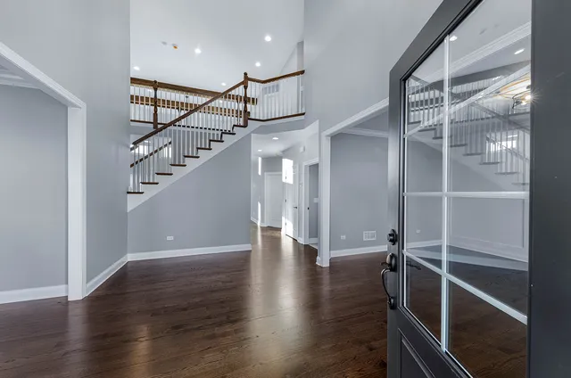 a view of entryway with stairs and wooden floor