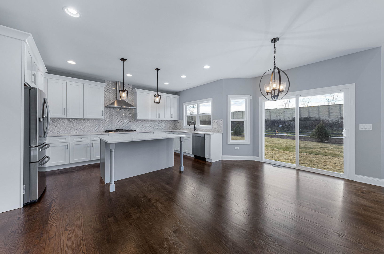 2004 Oldfield Road Darien, IL 60561 - Photo 6 of 40 a view of a kitchen with a sink and dishwasher wooden floor