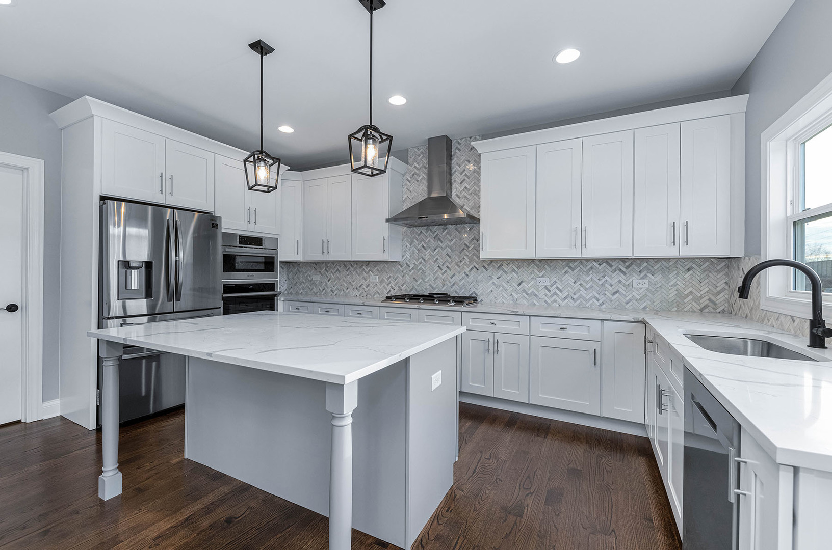 2004 Oldfield Road Darien, IL 60561 - Photo 7 of 40 a kitchen with stainless steel appliances granite countertop a sink a stove a refrigerator and island with wooden floor