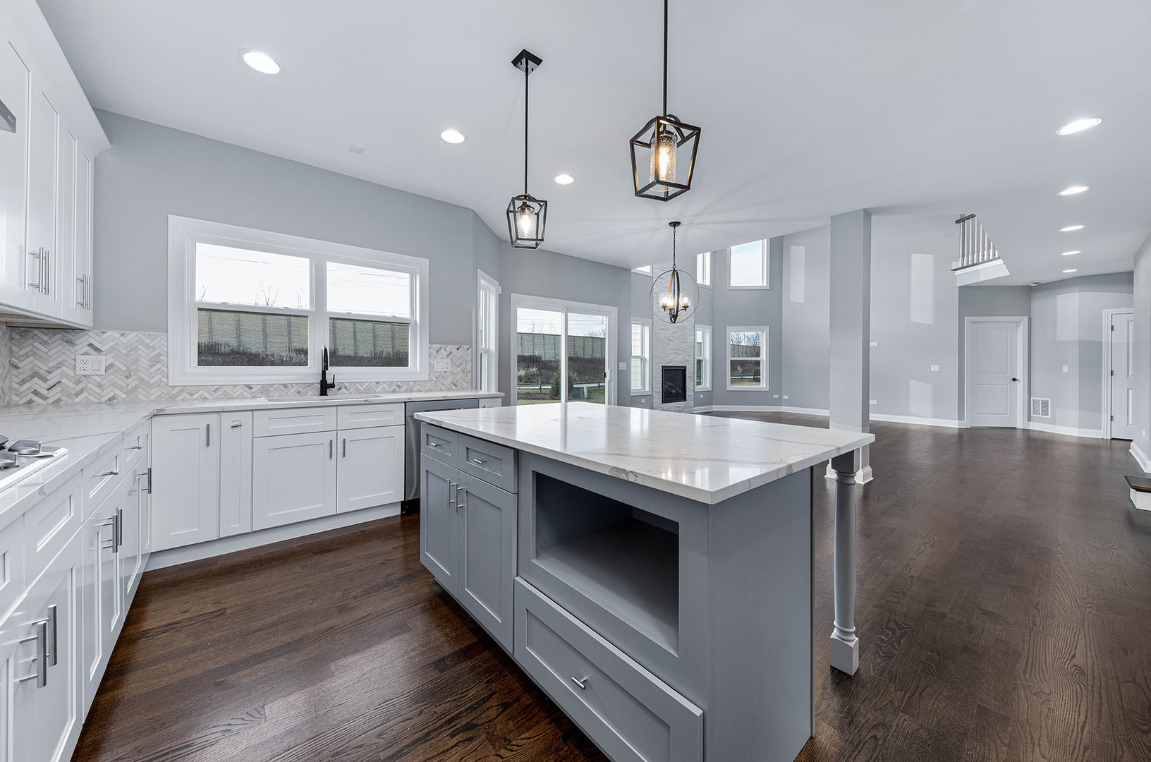 2004 Oldfield Road Darien, IL 60561 - Photo 9 of 40 a kitchen with stainless steel appliances granite countertop a sink a stove and a wooden floors