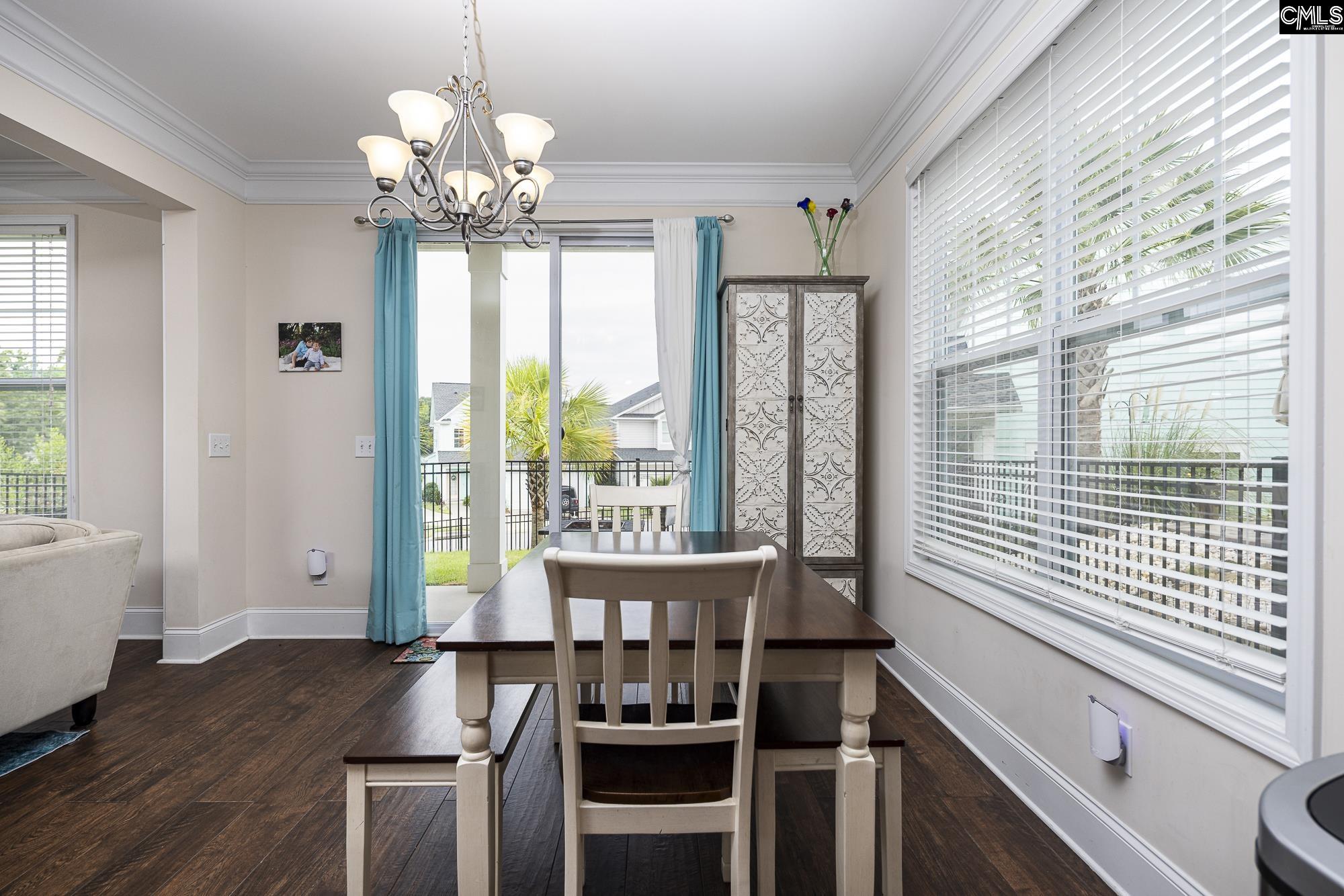 213 Sunset Point Drive Lexington, SC 29072 - Photo 14 of 35 a view of a dining room with furniture window and wooden floor
