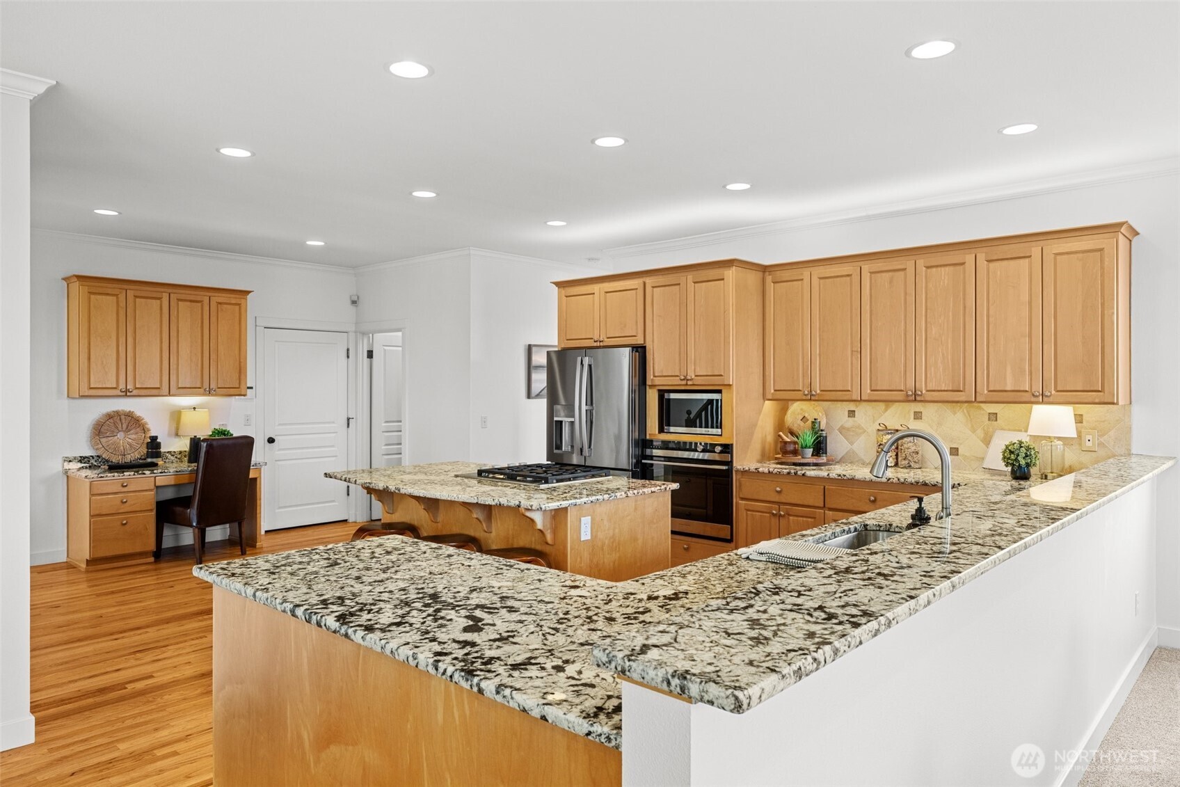 1802 Vernon Road Lake Stevens, WA 98258 - Photo 11 of 40 a kitchen with stainless steel appliances granite countertop a sink stove and refrigerator