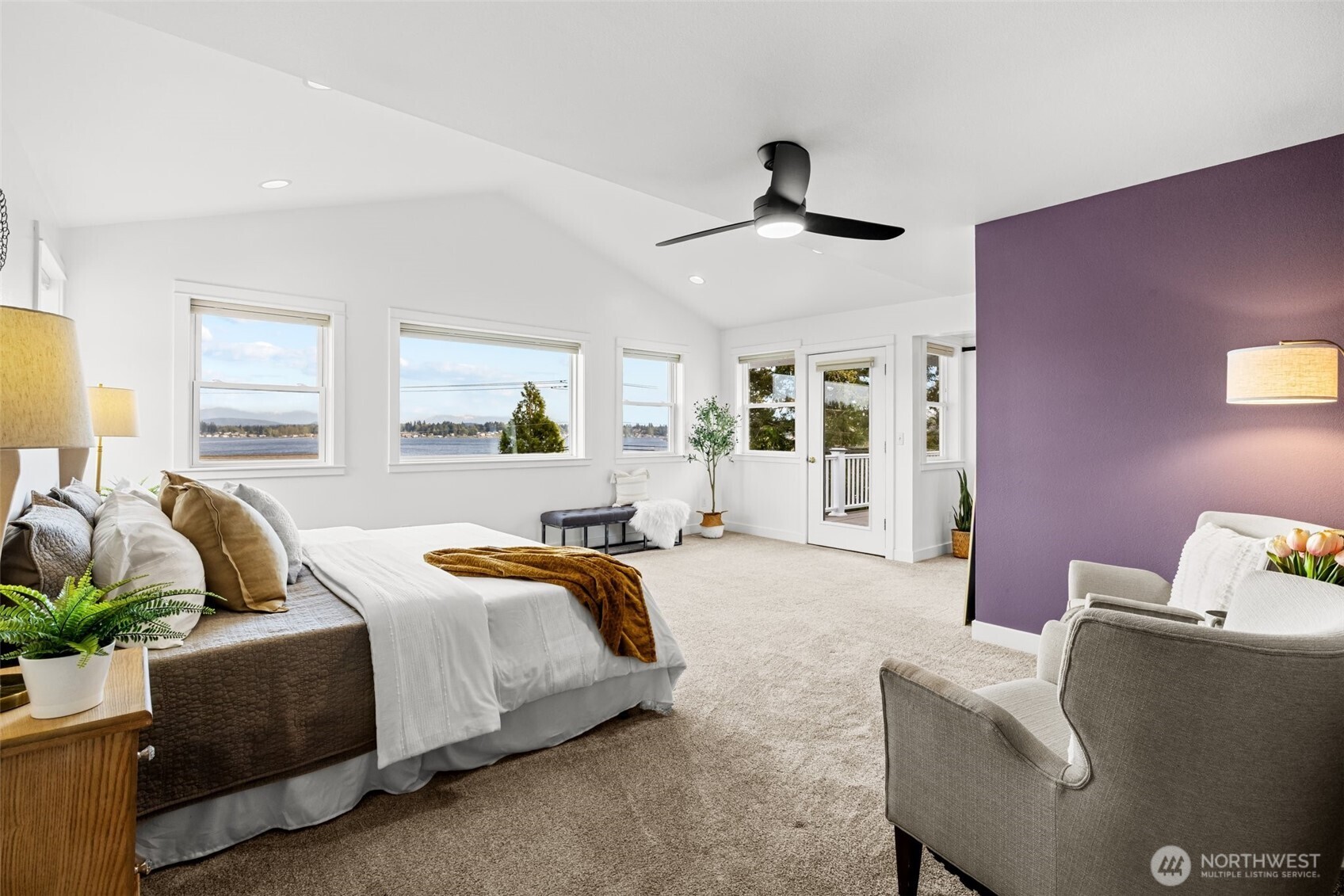 1802 Vernon Road Lake Stevens, WA 98258 - Photo 18 of 40 a spacious bedroom with a bed and wooden floor