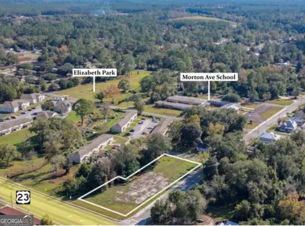 an aerial view of house with a yard