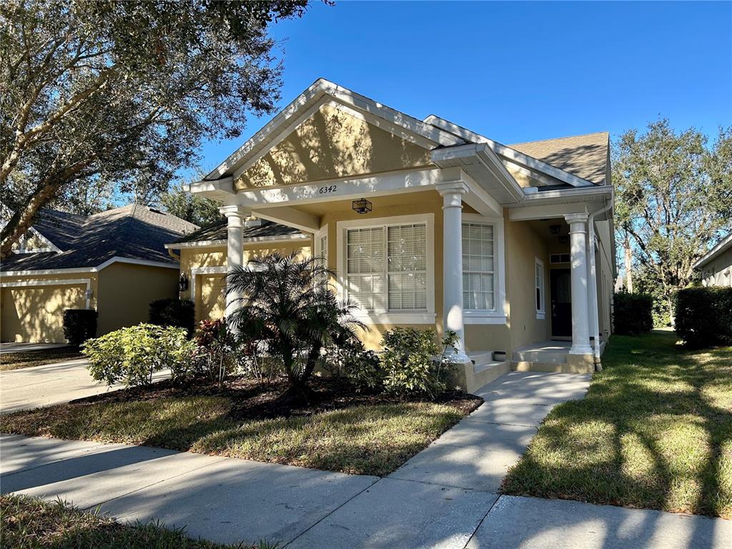 a view of a house with a yard