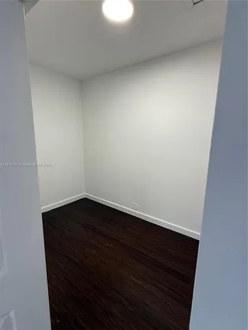 a view of small space with wooden floor