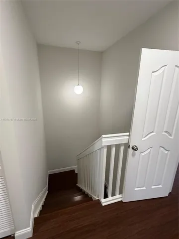 a view of entryway with wooden floor