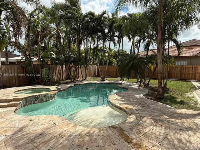 a view of a park with palm trees