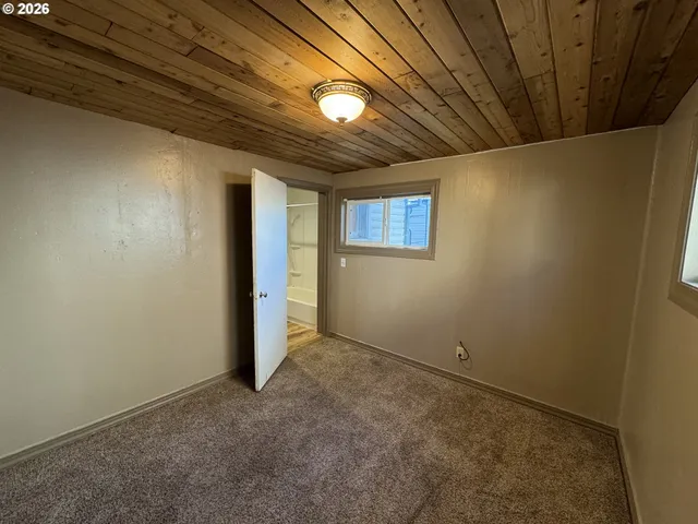 a view of empty room with windows