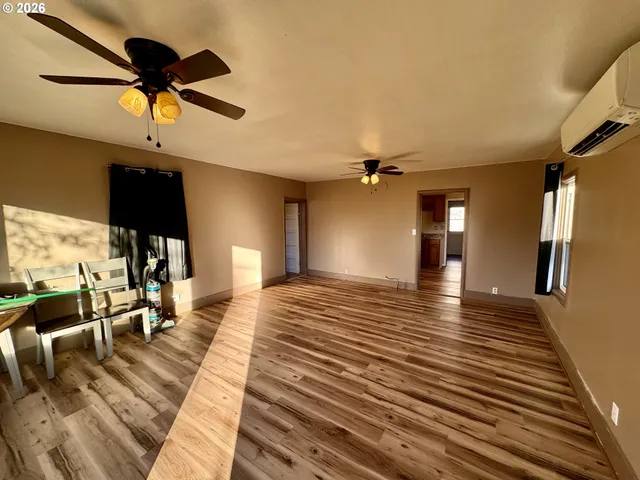 a view of a living room with a hard wood floor