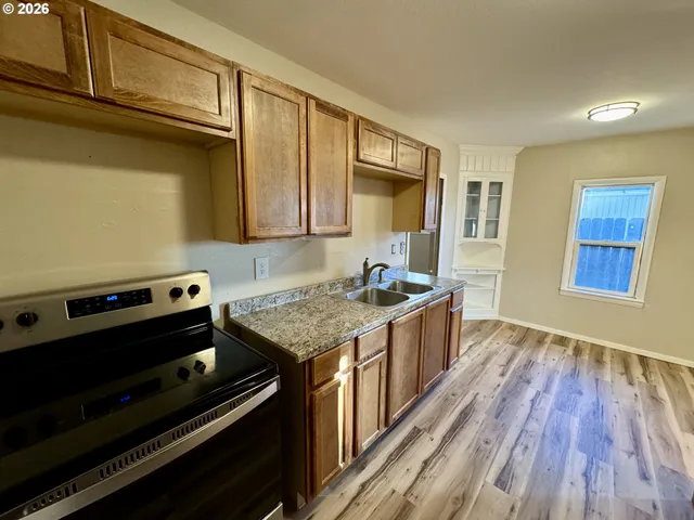 a kitchen with a stove and a microwave