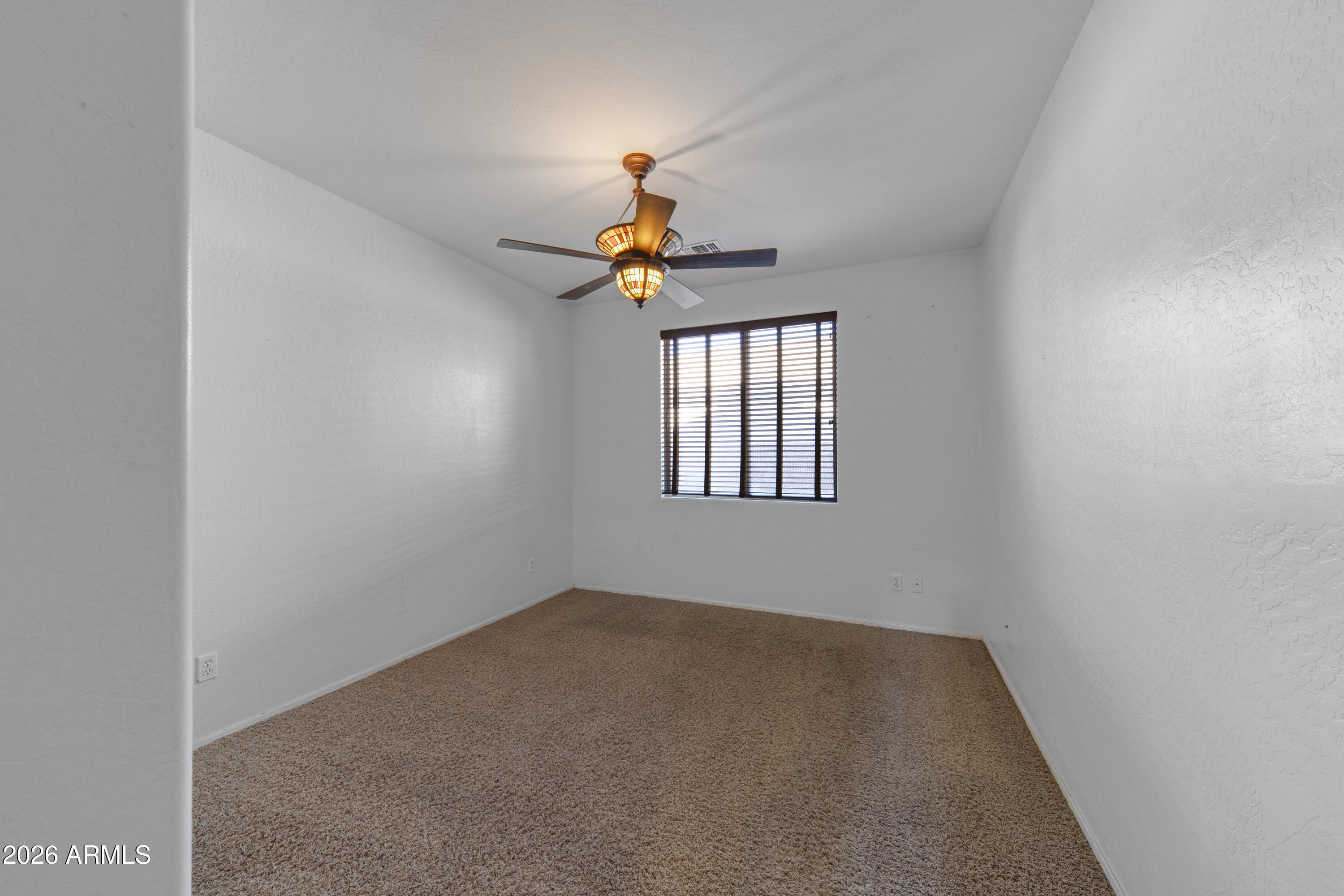 1813 East Beverly Road Phoenix, AZ 85042 - Photo 11 of 32 a window in an empty room