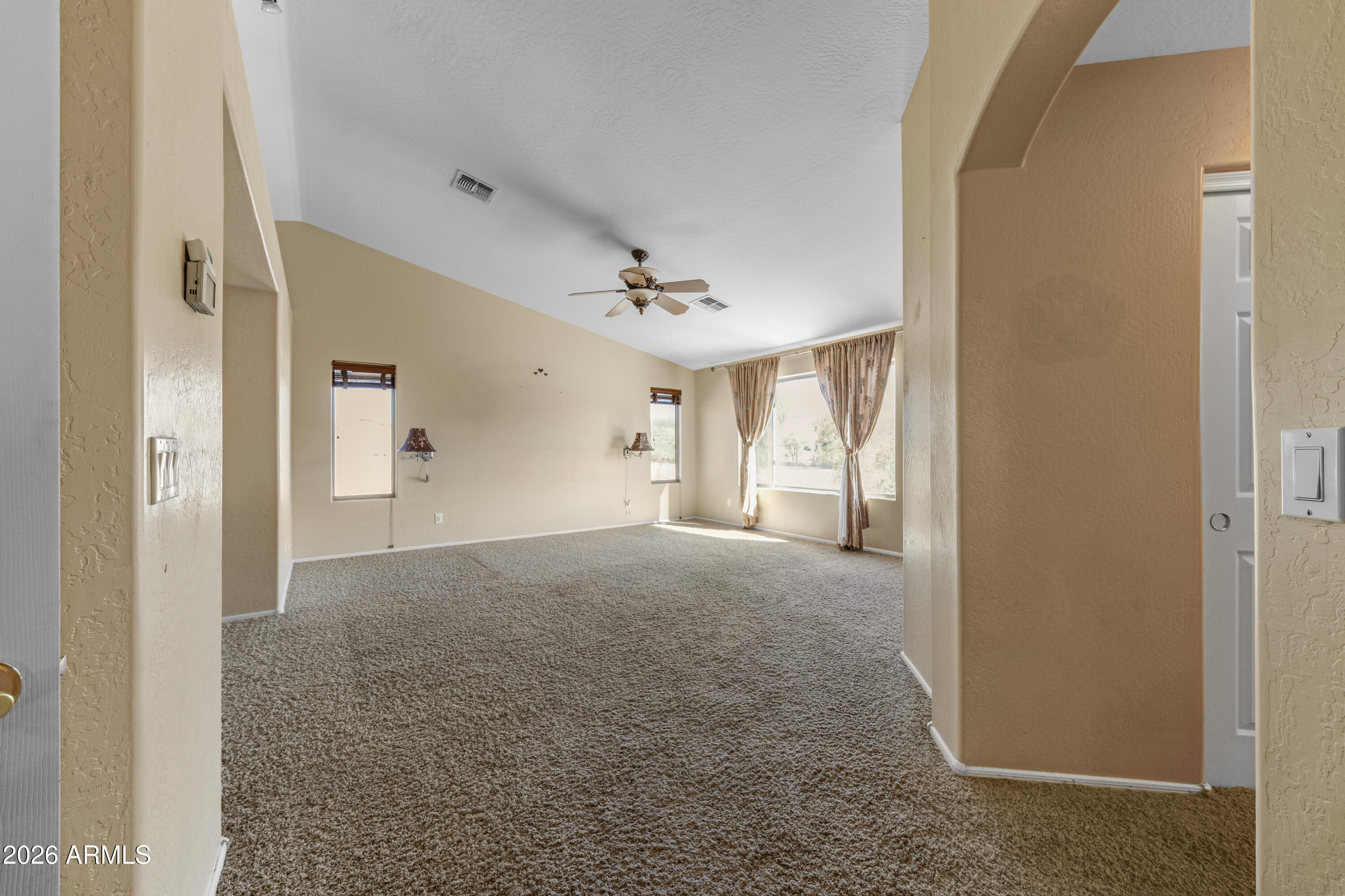 1813 East Beverly Road Phoenix, AZ 85042 - Photo 15 of 32 a view of a room with a windows and ceiling fan