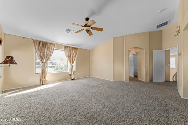 a view of empty room with windows