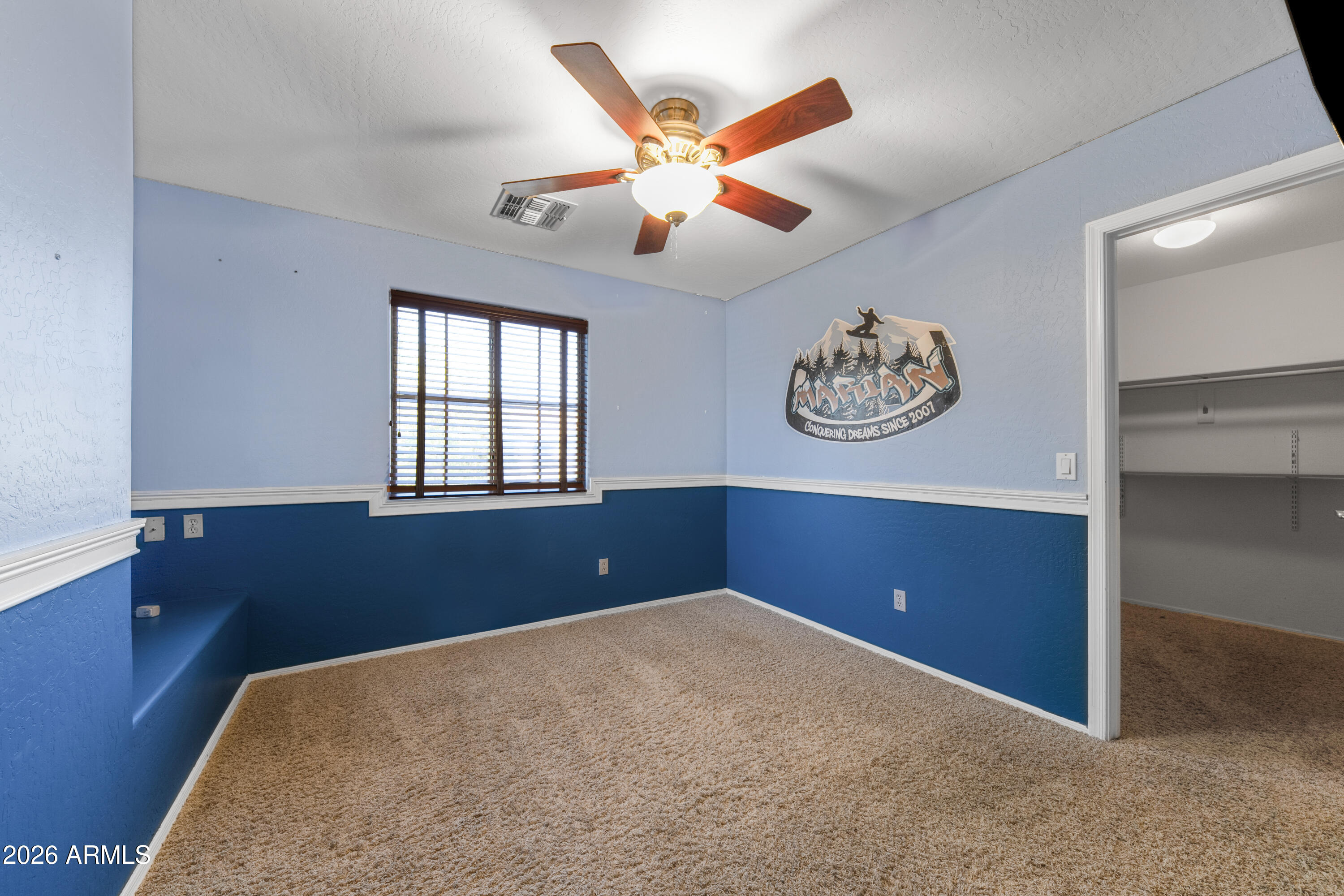 1813 East Beverly Road Phoenix, AZ 85042 - Photo 21 of 32 an empty room with window and ceiling fan