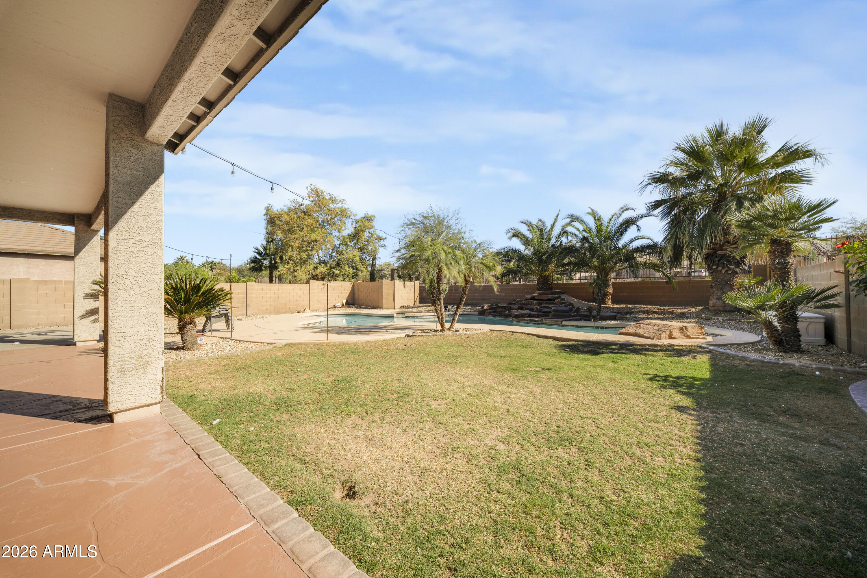 1813 East Beverly Road Phoenix, AZ 85042 - Photo 24 of 32 a view of swimming pool with outdoor seating and house in the background