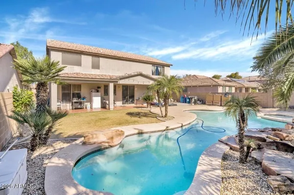 a view of a swimming pool with a patio