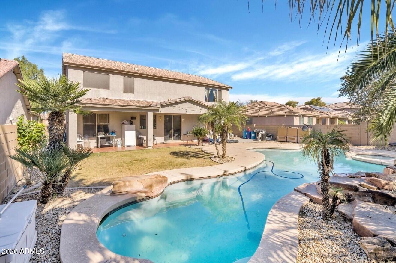 1813 East Beverly Road Phoenix, AZ 85042 - Photo 27 of 32 a swimming pool with outdoor seating and yard