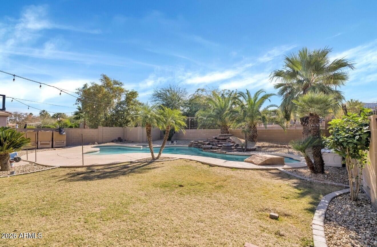 1813 East Beverly Road Phoenix, AZ 85042 - Photo 28 of 32 a view of a swimming pool with a patio