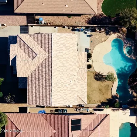 an aerial view of residential building with green space