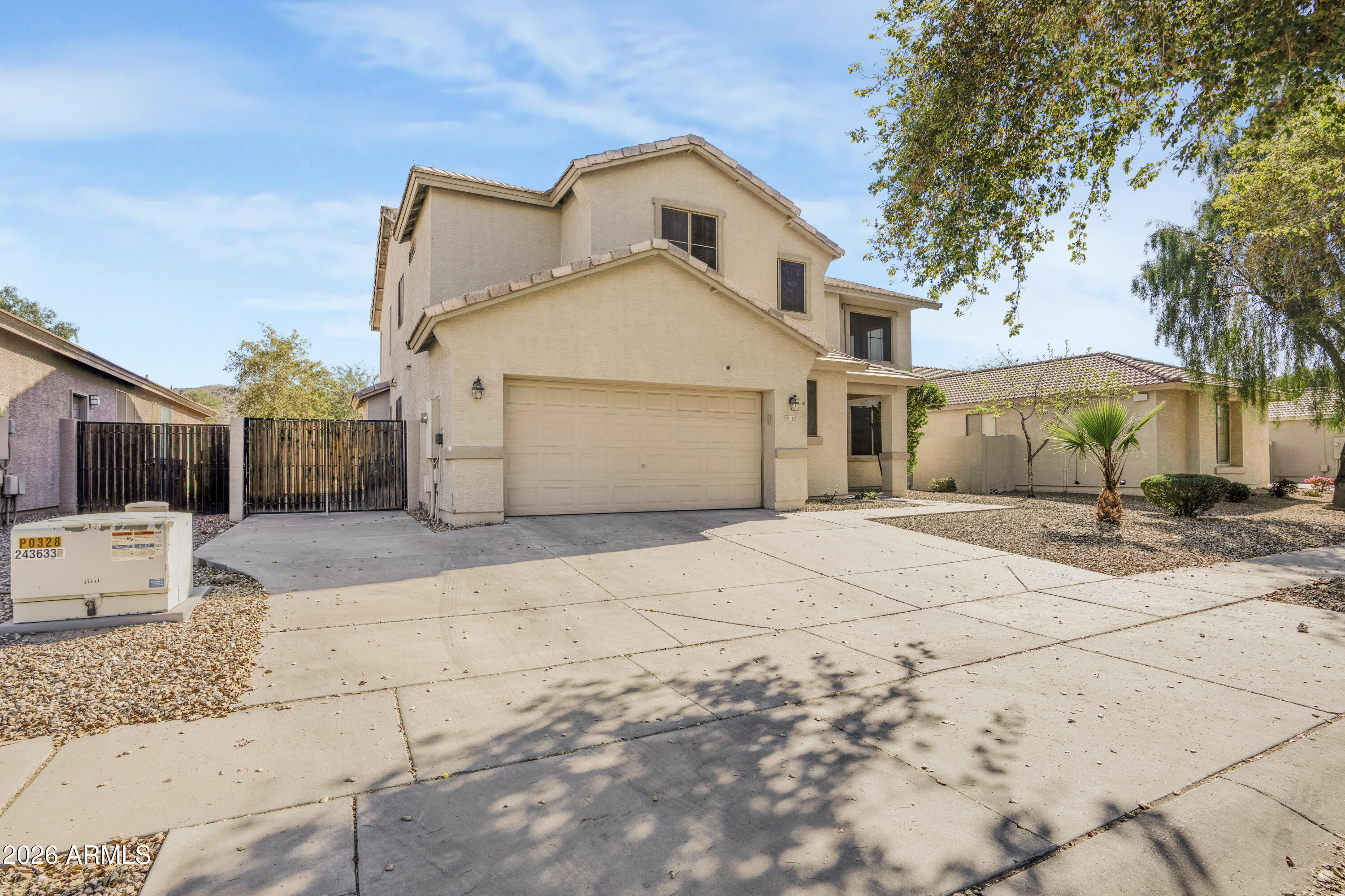 1813 East Beverly Road Phoenix, AZ 85042 - Photo 3 of 32 a front view of a house with a yard and garage