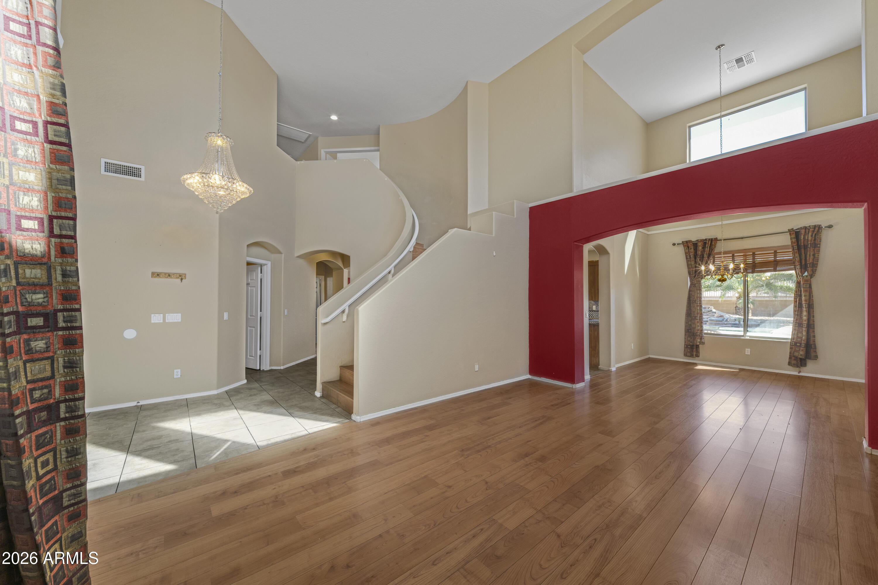 1813 East Beverly Road Phoenix, AZ 85042 - Photo 4 of 32 a view of a livingroom with wooden floor and stairs