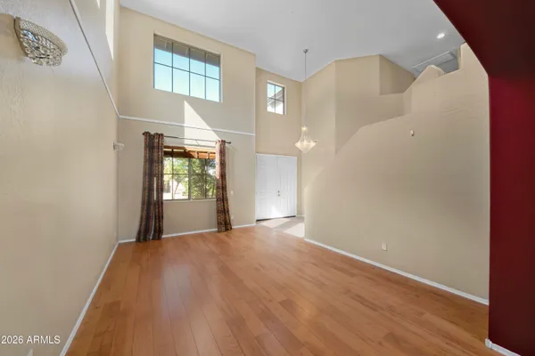 a view of a big room with windows and closet