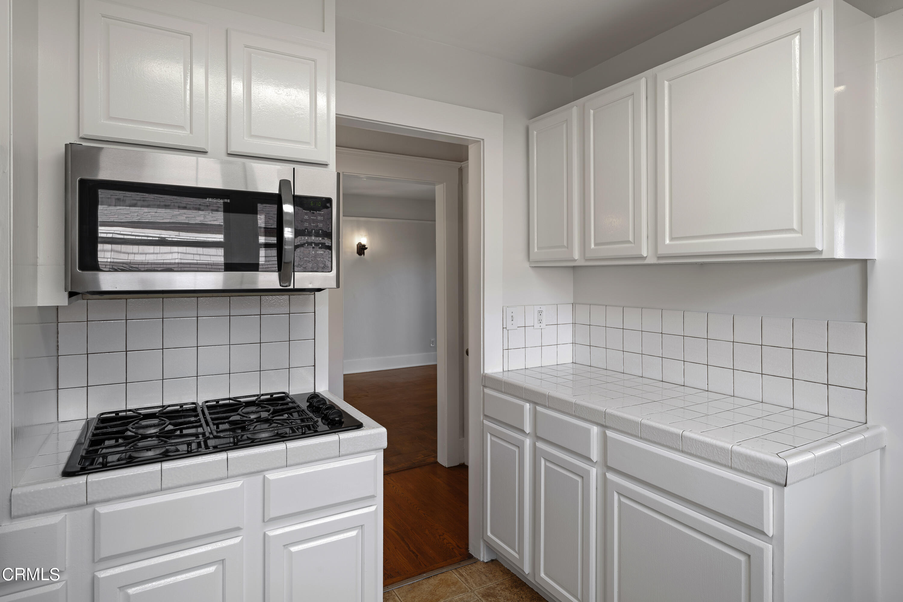 489 Miles Street Pasadena, CA 91106 - Photo 13 of 46 a kitchen with cabinets and appliances