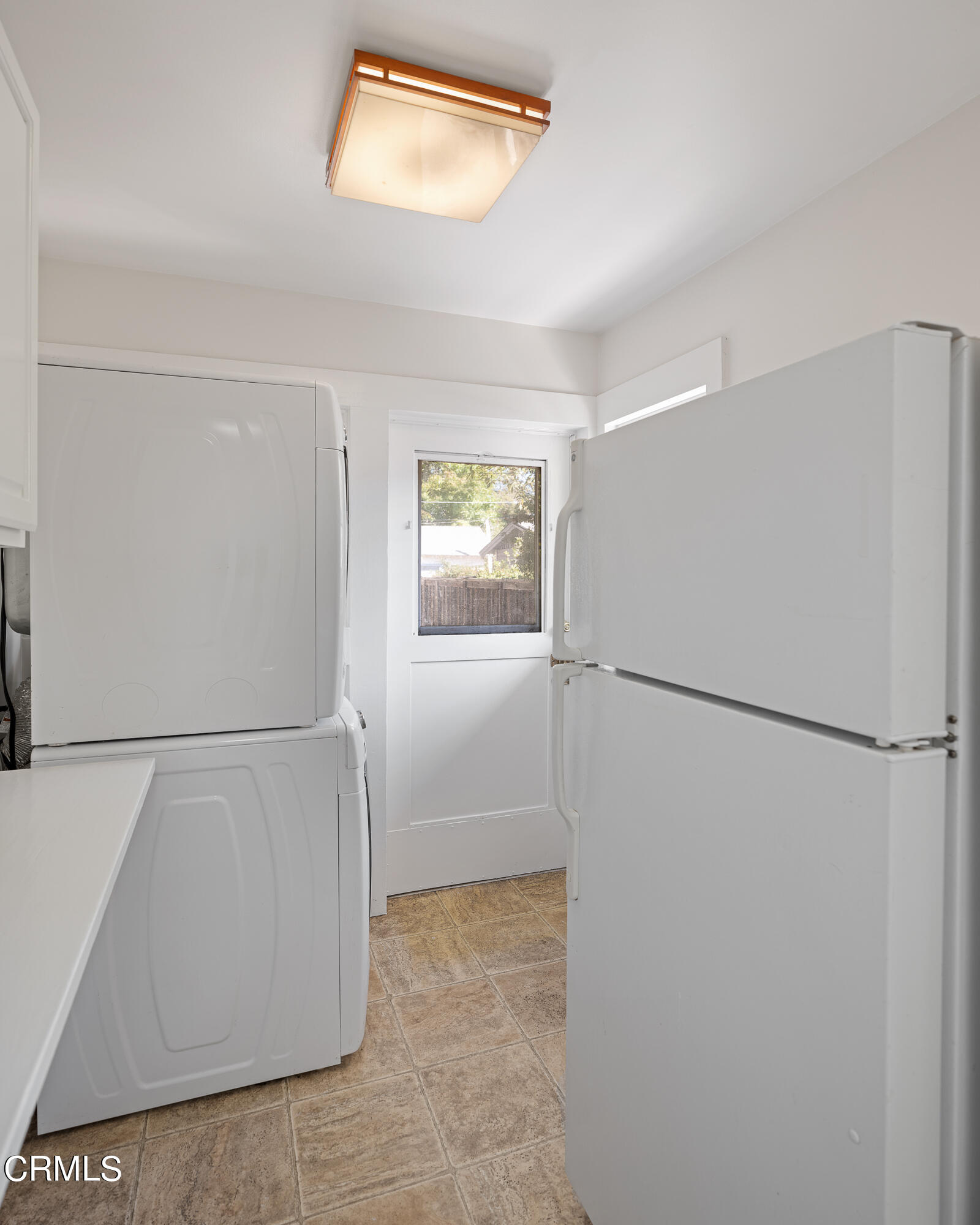 489 Miles Street Pasadena, CA 91106 - Photo 17 of 46 a view of a kitchen with refrigerator and white wall