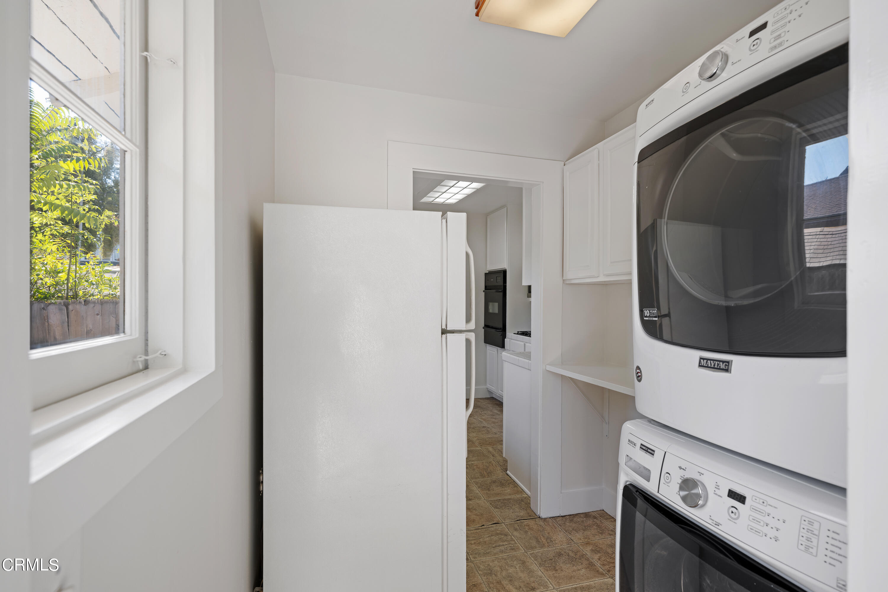 489 Miles Street Pasadena, CA 91106 - Photo 18 of 46 a kitchen with a refrigerator sink and a stove top oven