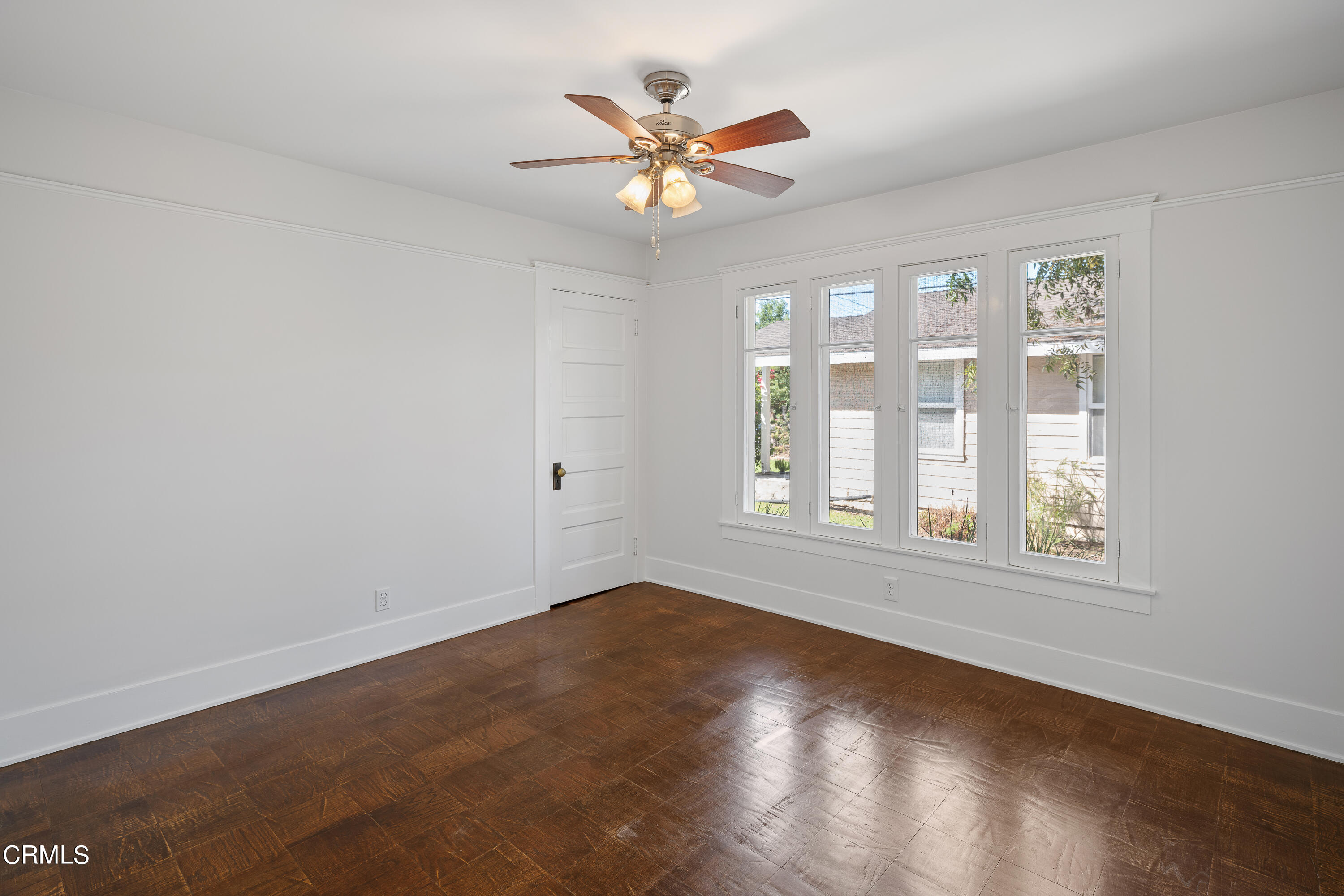 489 Miles Street Pasadena, CA 91106 - Photo 19 of 46 an empty room with wooden floor and windows