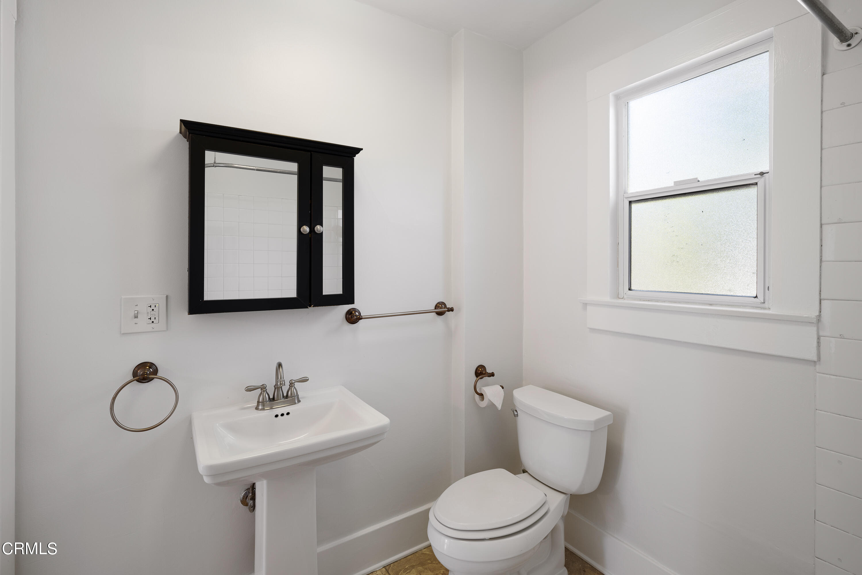 489 Miles Street Pasadena, CA 91106 - Photo 22 of 46 a bathroom with a toilet sink and mirror