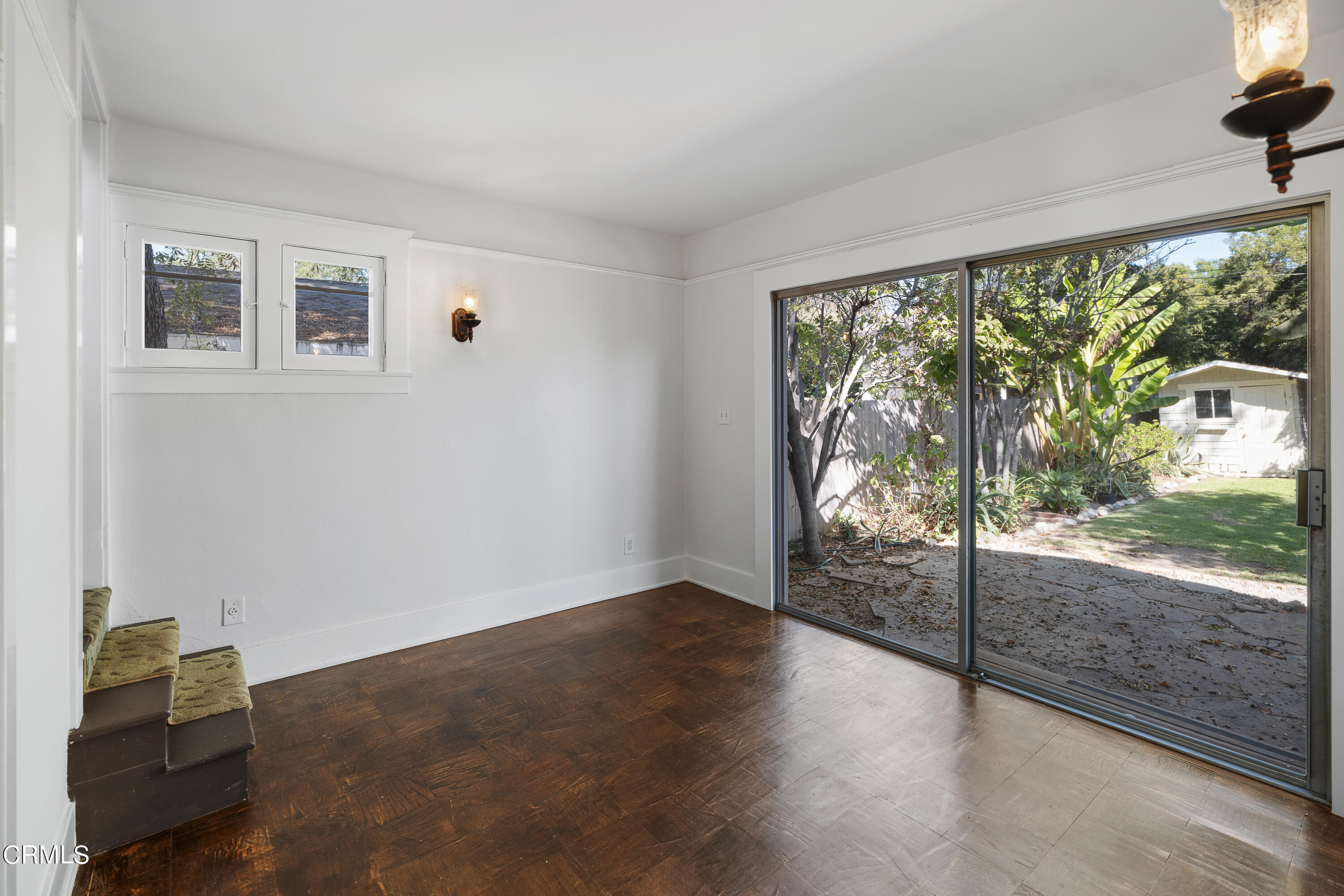 489 Miles Street Pasadena, CA 91106 - Photo 23 of 46 an empty room with wooden floor and windows