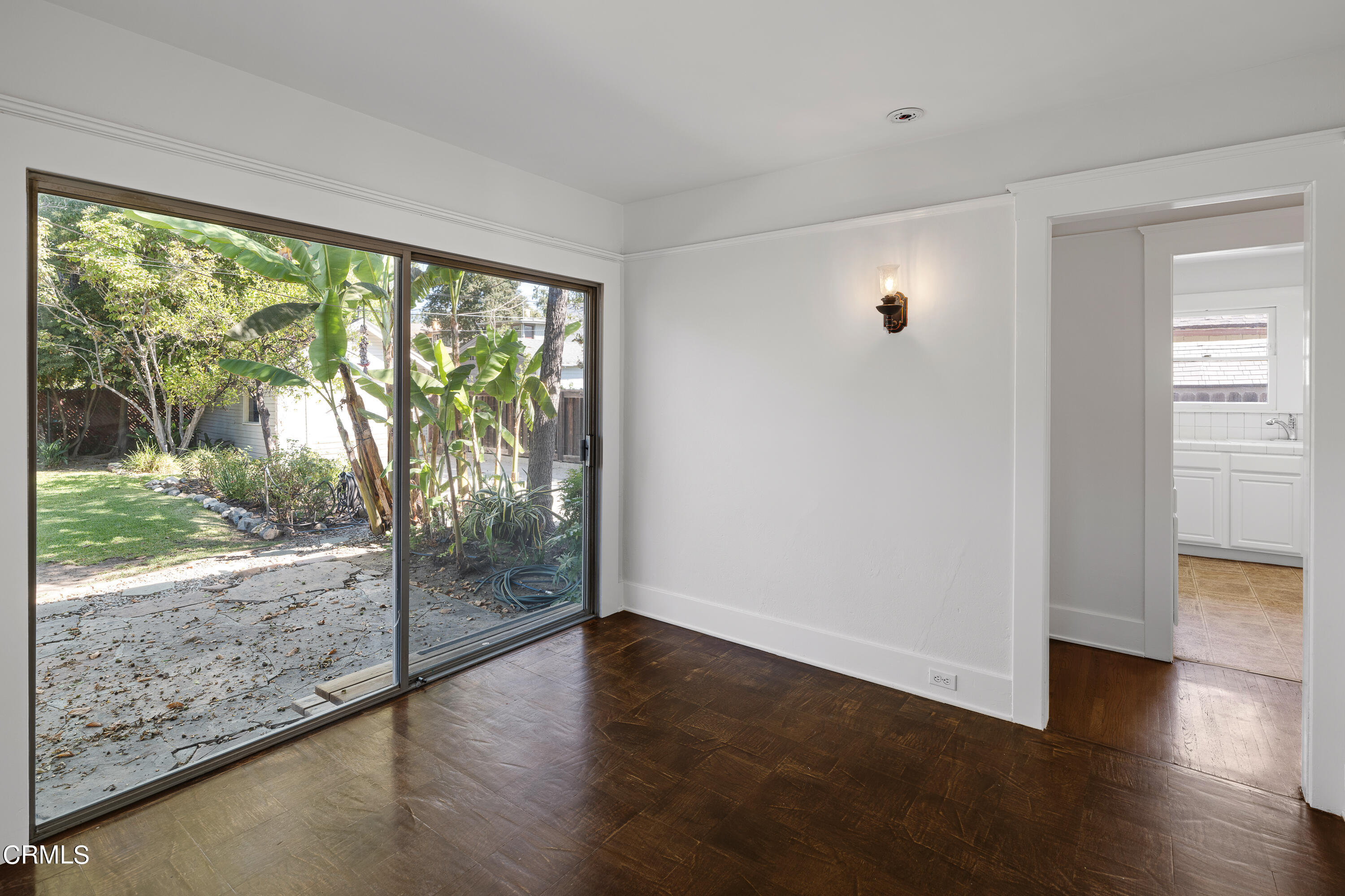 489 Miles Street Pasadena, CA 91106 - Photo 24 of 46 an empty room with wooden floor and windows