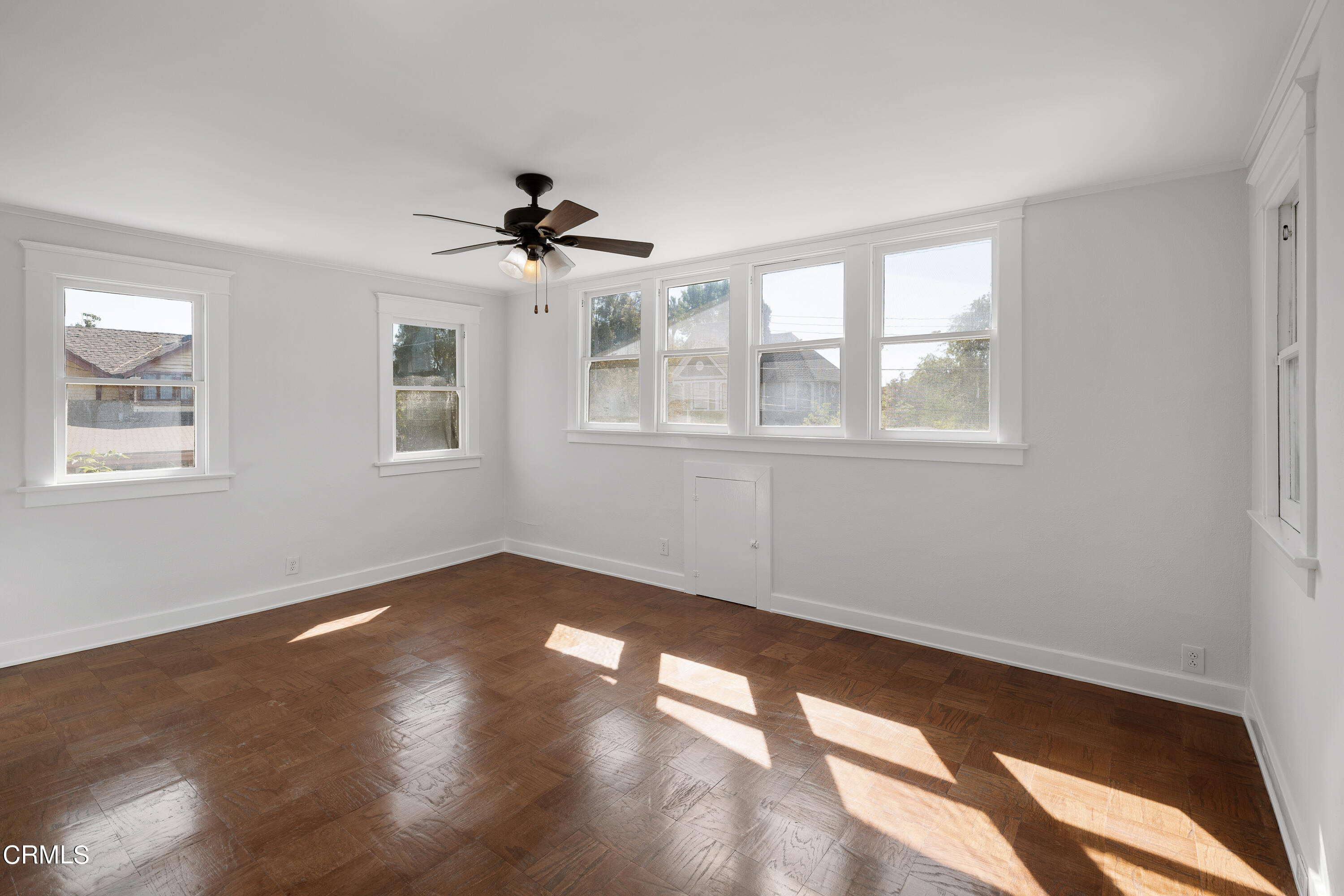 489 Miles Street Pasadena, CA 91106 - Photo 27 of 46 a view of an empty room with wooden floor and a window