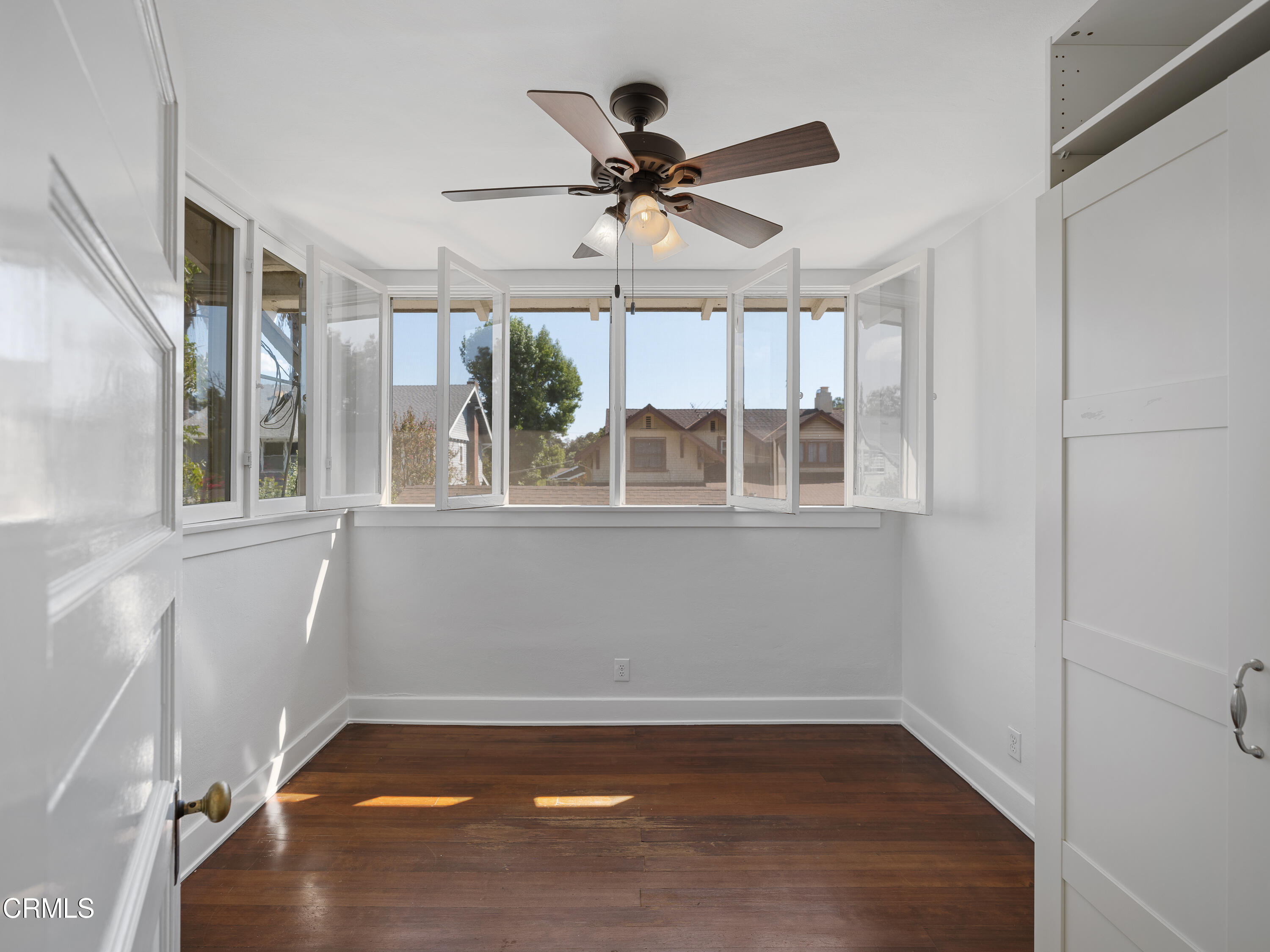 489 Miles Street Pasadena, CA 91106 - Photo 30 of 46 an empty room with wooden floor and windows