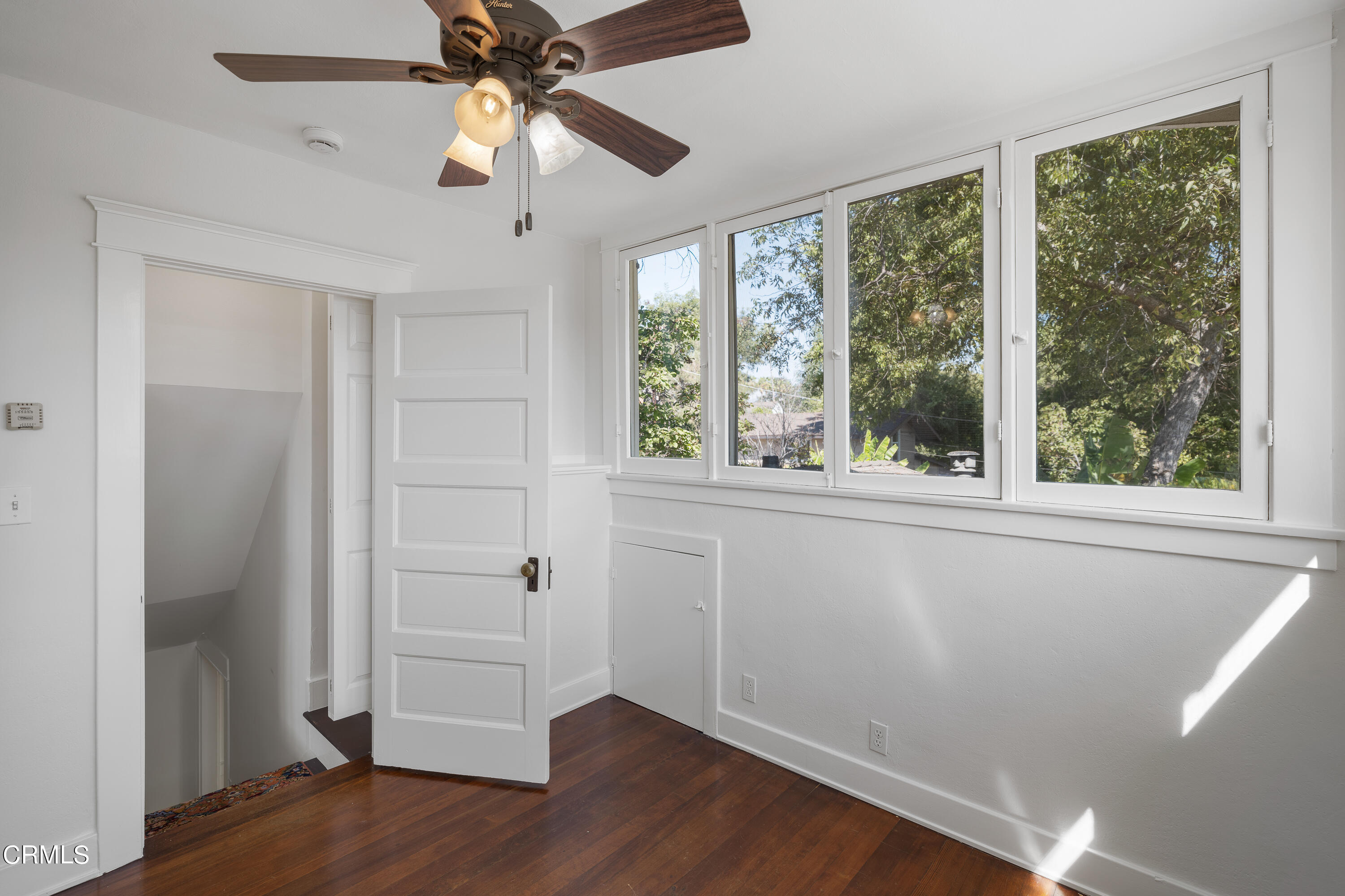 489 Miles Street Pasadena, CA 91106 - Photo 31 of 46 a view of an empty room with wooden floor and a window