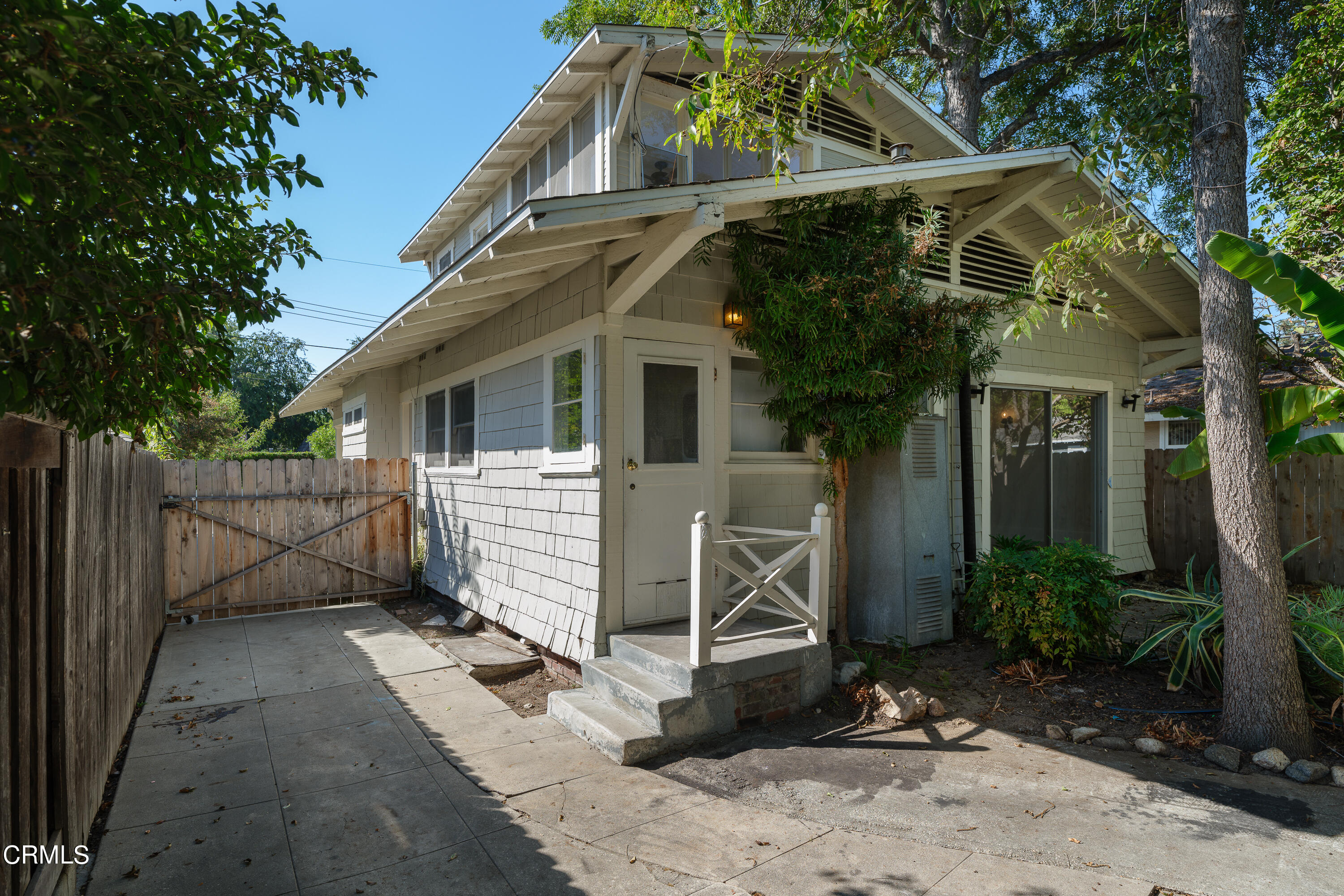 489 Miles Street Pasadena, CA 91106 - Photo 33 of 46 a view of a white house with large windows and plants
